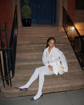 Woman wearing all white outfit.