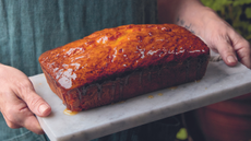 Almond marmalade cake from Sarah Johnson's 'Fruitful' recipe book on a slab of marble.