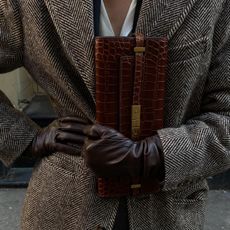 Christie Tyler with a croc-effect Saint Laurent clutch