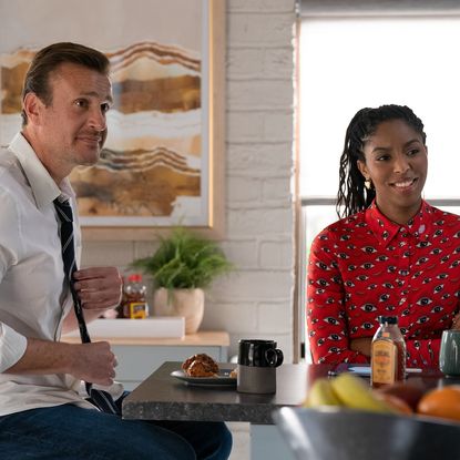 Jason Segel as Jimmy and Jessica Williams as Gaby, sitting at the counter in an office kitchen, in 'Shrinking'