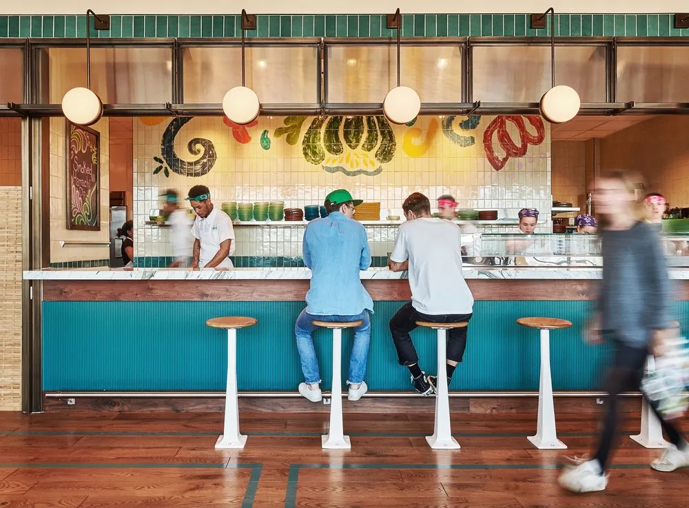 Two people sitting at the bar