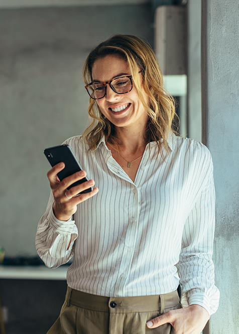 Business woman looking at phone