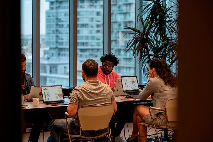 A team in a room running a working session