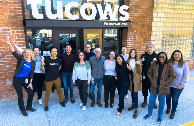 Group of employees outside the Tucows headquarters in Toronto, Canada.