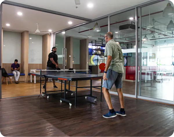 Deriv employees playing table tennis