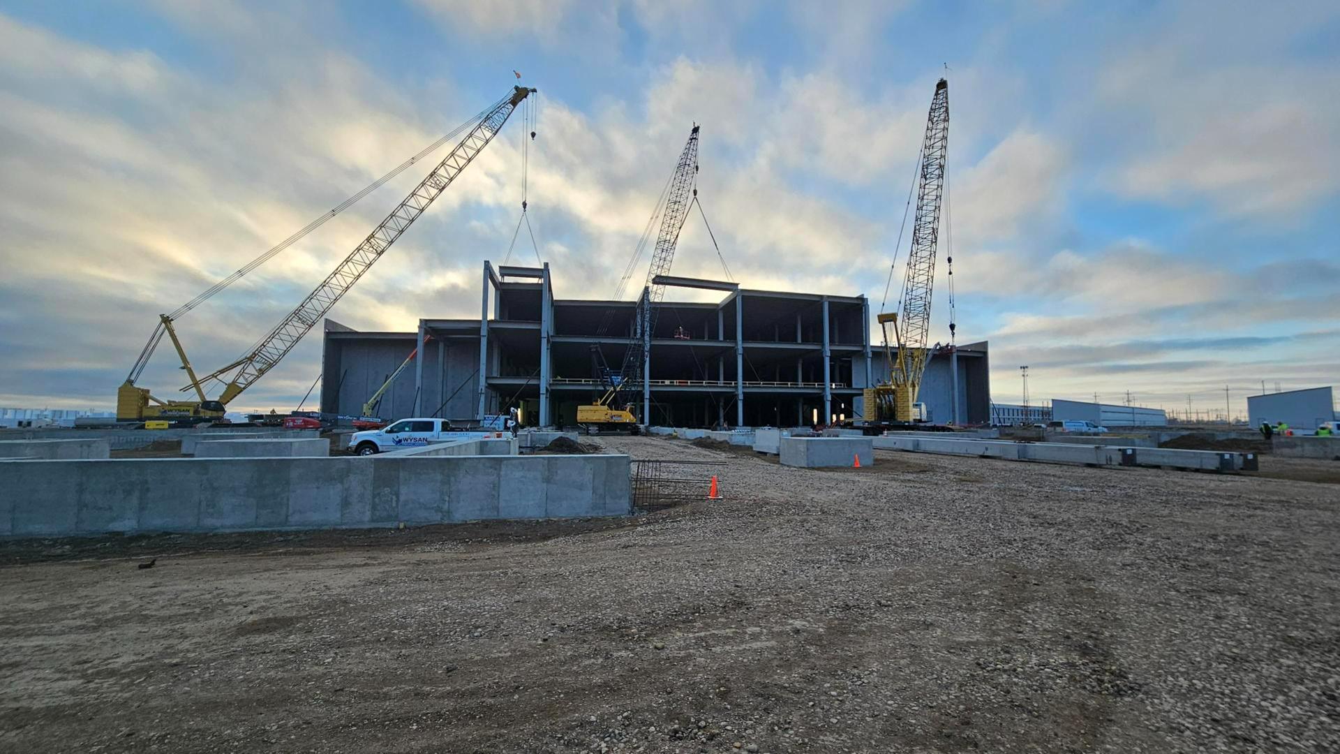 a view of construction cranes building a data center