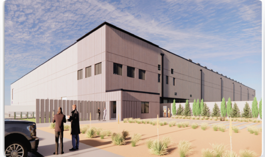 a view of a data center from the outside. there are two people standing, looking at building plans