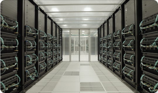 an interior view of a row of servers inside of a data center