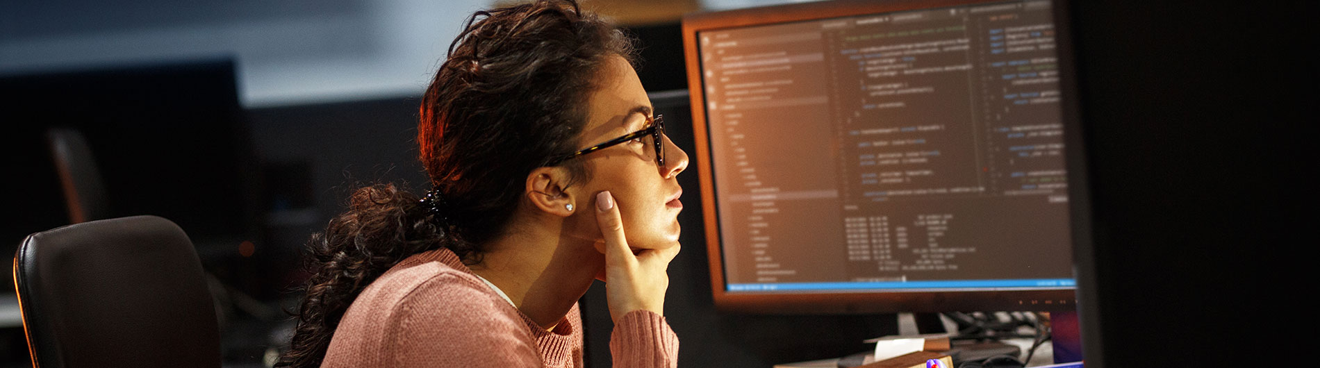 student reading information on a computer screen