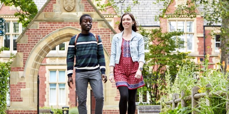 two students walking on campus