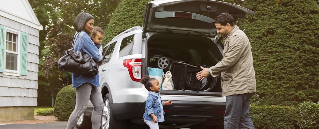 Family packing up a car