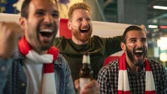 Three soccer fans cheering. | Rido | Dreamstime.com