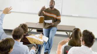 College professor lecturing students | Photo 33896129 © Photographerlondon | Dreamstime.com