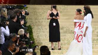 Alexandria Ocasio-Cortez wears a dress that says "Tax the Rich" at the 2021 Met Gala | NDZ/starmaxinc.com/Newscom