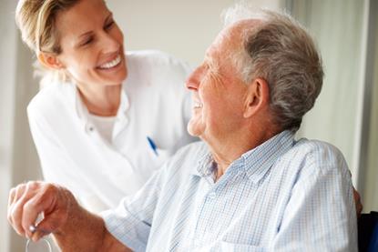 Patient and health worker smiling at each other