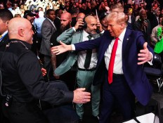 Trump & Joe Rogan Share A Victory Hug As Former & Future POTUS Attends UFC 309 At MSG