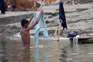 Boy bathes in a river