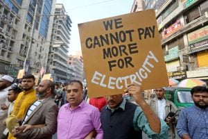 people holding protest signs