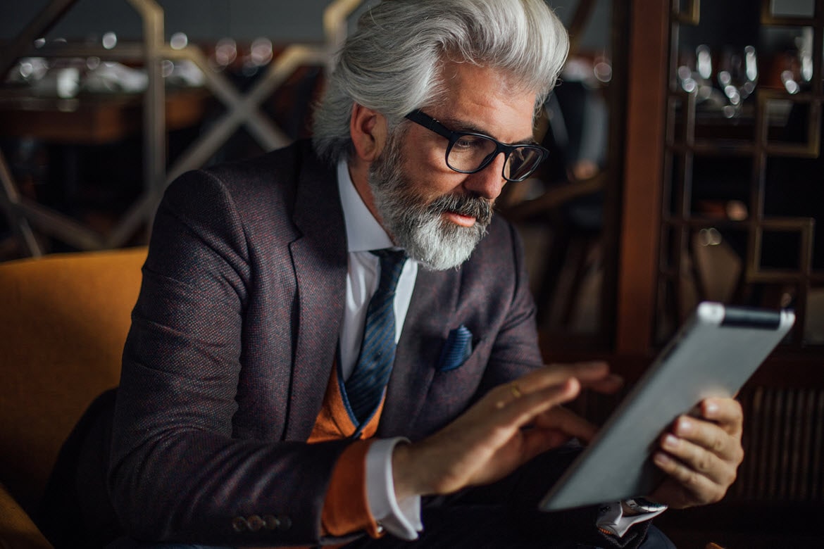 Sophisticated man using a tablet