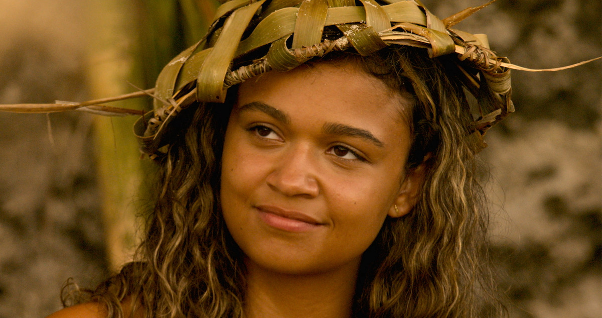 Kiara wears a hat woven from twigs and leaves in Poguelandia.