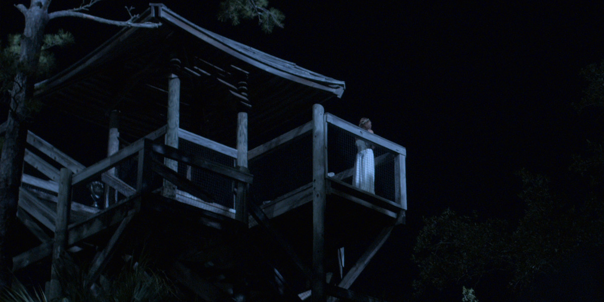 Topper and Sarah stand at the top of the tower at night after John B is pushed off the ledge.