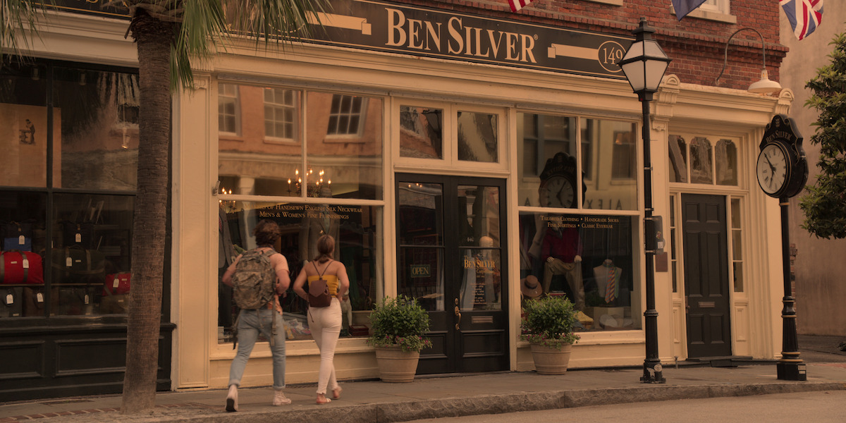 John B and Sarah walk into Ben Silver to shop.