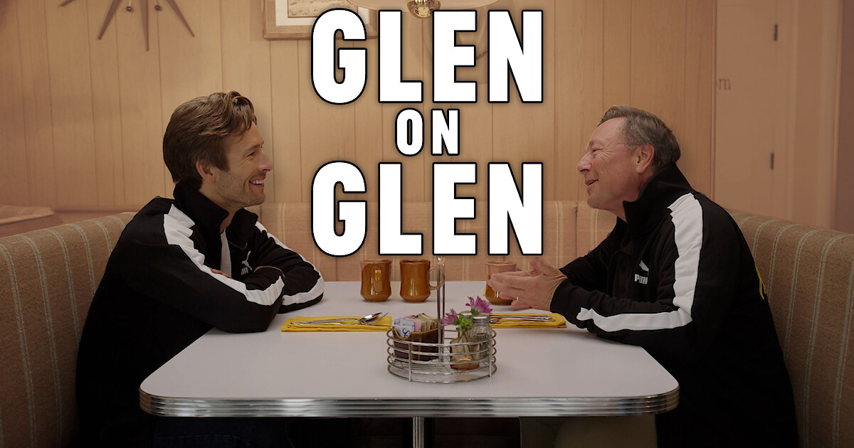 Glen Powell, left, sitting in a diner booth across from his father, Glen Powell Sr.