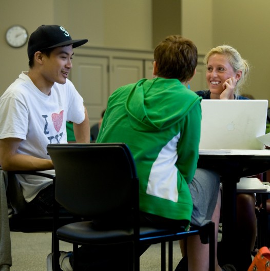 Students working at tables in the Suzzallo Library cafe