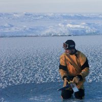 An Astrobiology researcher in a snowy landscape.