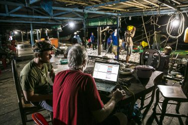 Researchers from the School of Aquatic and Fishery Sciences and the Cooperative Institute for Climate, Ocean, & Ecosystem Studies work with project partners to install a proof-of-concept echosounder at a fishery in Cambodia’s Tonlé Sap River, a system increasingly impacted by dams.