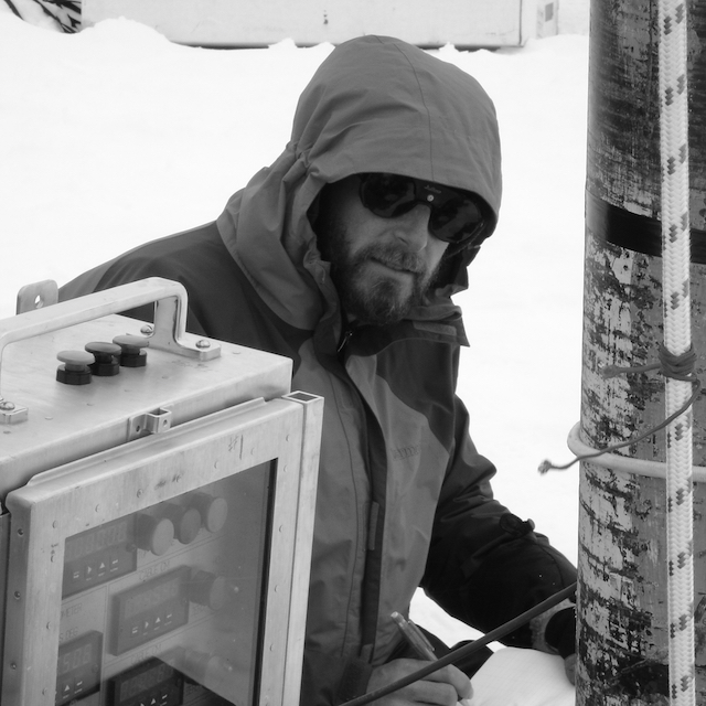 Black and White close up of Eric Steig with snow in the background.