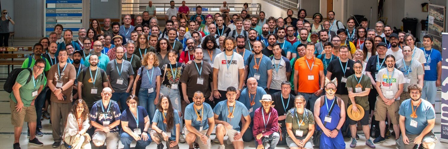 Akademy 2023 group photo in hte main hall.