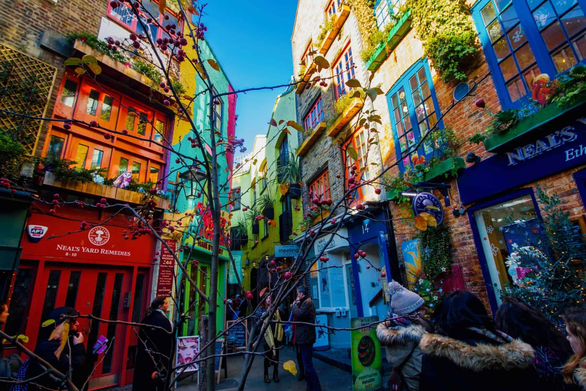 Colorful brick buildings on a narrow street in London.