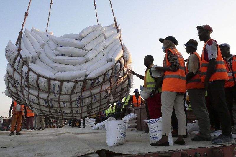 Rice bags are offloaded from a cargo vessel in Moroni, Comoros, on Oct. 3.