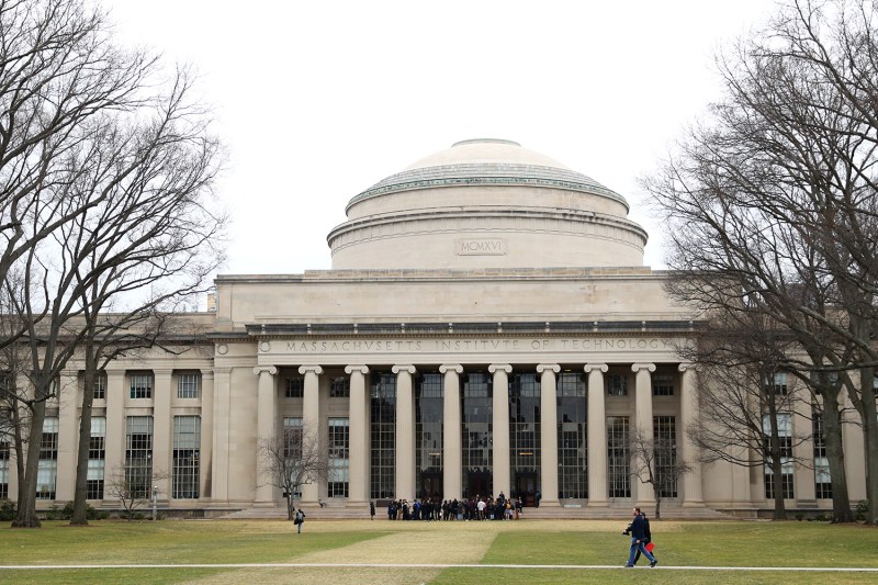 People walk in front of building 10 on the campus of Massachusetts Institute of Technology