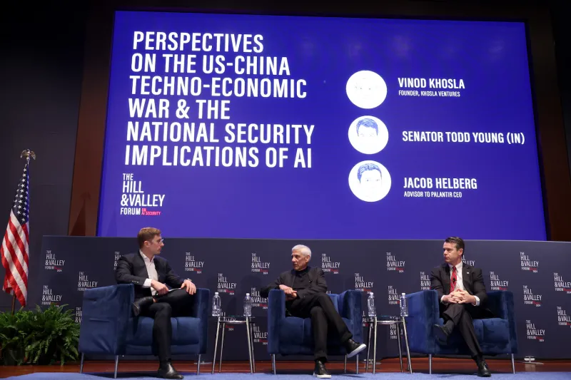 From left to right: Jacob Helberg, an advisor to Palantir's CEO; Vinod Khosla, founder, Khosla Ventures; and Republican Sen. Todd Young speak onstage at the Hill & Valley Forum on AI security at the U.S. Capitol Visitor Center in Washington, D.C.