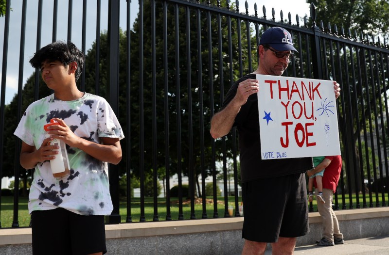 Glenn Boyce and his family show support for U.S. President Joe Biden after he announced his withdrawal from the 2024 presidential race outside the White House in Washington.