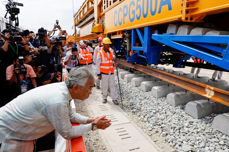 Malaysian King Sultan Abdullah Sultan Ahmad Shah observes track laying of the East Coast Rail Link in Kuantan, Malaysia on Dec. 11, 2023.