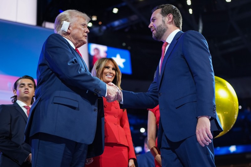 Republican presidential nominee, former U.S. President Donald Trump shakes hands with Republican vice presidential nominee, U.S. Sen. J.D. Vance (R-OH) after officially accepting the Republican presidential and vice presidential nominations on the fourth day of the Republican National Convention on July 18, in Milwaukee, Wisconsin.