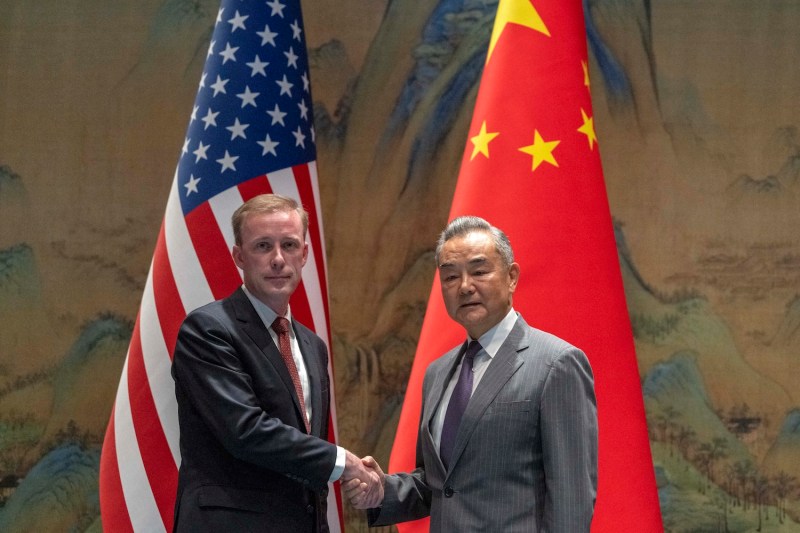 U.S. National Security Advisor Jake Sullivan shakes hands with Chinese Foreign Minister Wang Yi in Beijing.