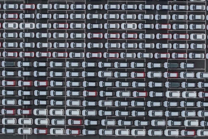 Cars wait to be loaded onto a vessel for export at a port in Taicang, China.