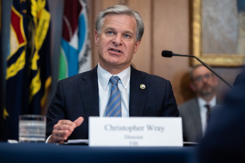 FBI Director Christopher Wray delivers opening remarks at a meeting of the Justice Department’s Election Threats Task Force in Washington, D.C.