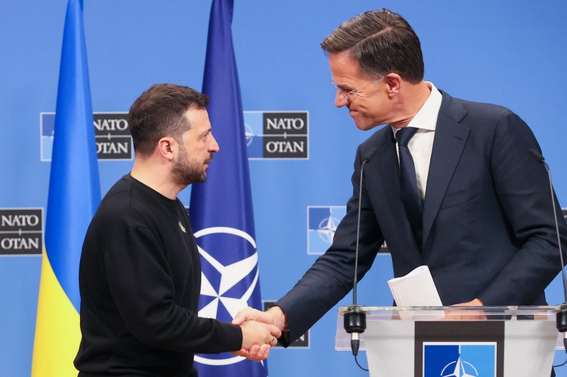 NATO Secretary General Mark Rutte (right) welcomes Ukrainian President Volodymyr Zelensky as he arrives for a press conference at the NATO headquarters in Brussels on Oct. 17.