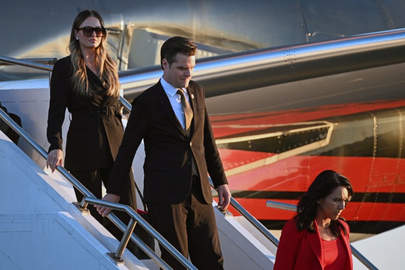 Rep. Matt Gaetz and former Rep. Tulsi Gabbard step off a plane at Philadelphia International Airport on Sept. 10.