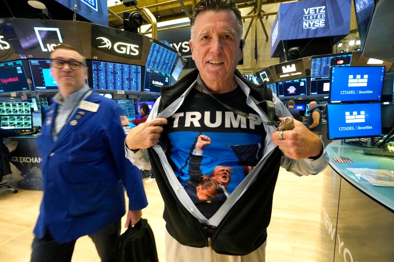 Trader Walter Lundon shows off his shirt featuring U.S. President-elect Donald Trump.