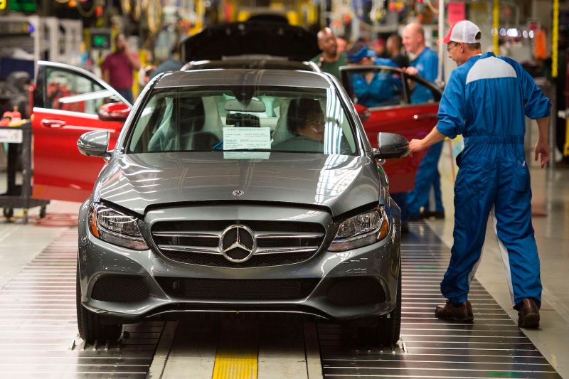 Employees inspect cars at the Mercedes-Benz US International factory in Vance, Alabama on June 8, 2017.