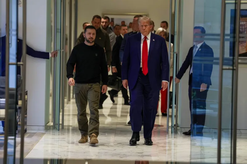 Ukrainian President Volodymyr Zelensky and former U.S. President Donald Trump arrive for a meeting at Trump Tower in New York City on Sept. 27.