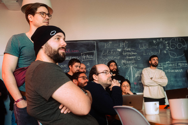 freiheit.com employees at a meeting