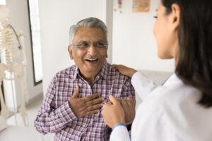 doctor reassuring her senior patient