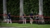 FILE - FBI officers search the perimeter of Trump International Golf Club after an apparent assassination attempt on Republican presidential nominee and former U.S. President Donald Trump at the course in West Palm Beach, Florida, Sept. 17, 2024. 